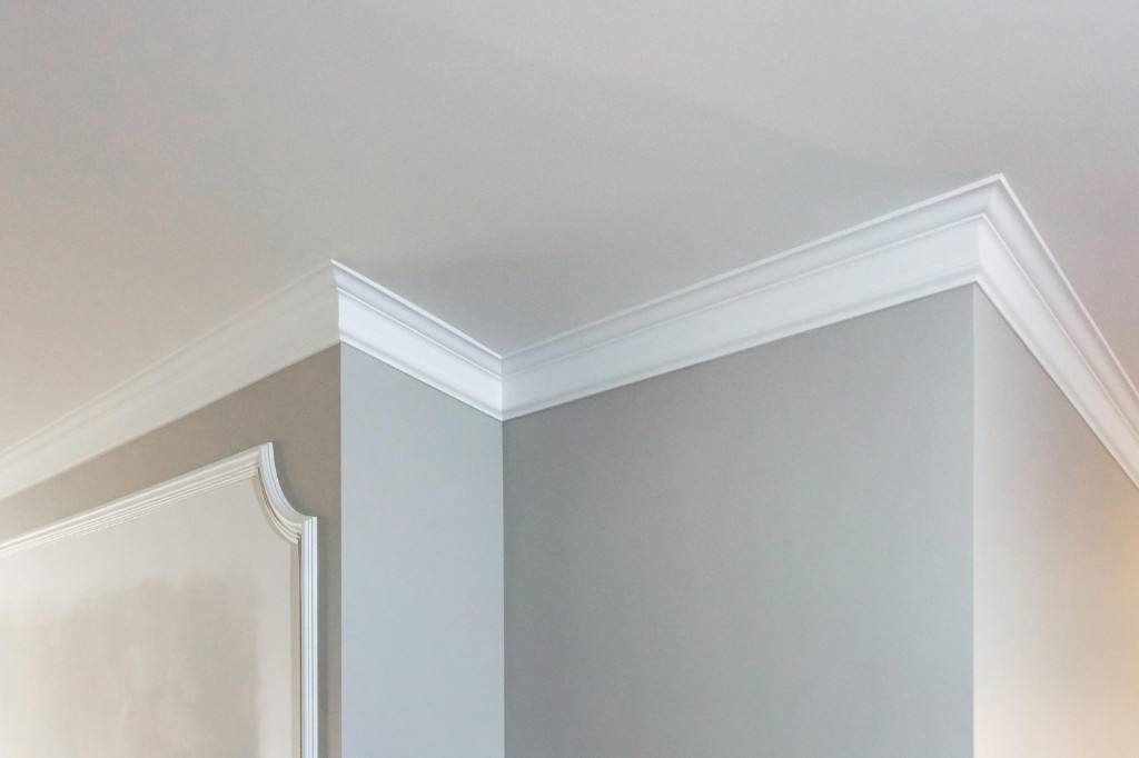 Finished crown molding and decorative wall trim after interior paint